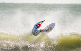 Frigid weather doesn’t stop Santas surfing off Florida coast