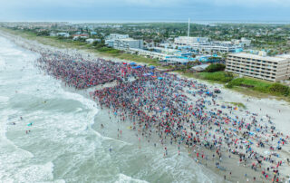 Surf’s up, Santa! Hundreds of festive surfers hit the Florida shore