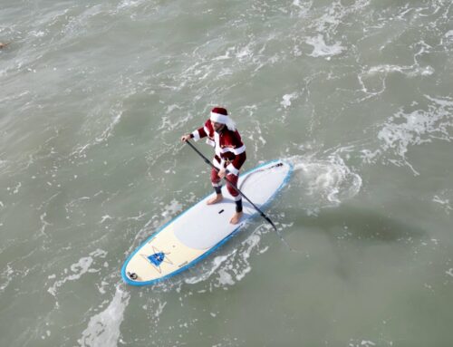 A Huge Crowd of Surfing Santas Paddled Out in Florida on Christmas Eve